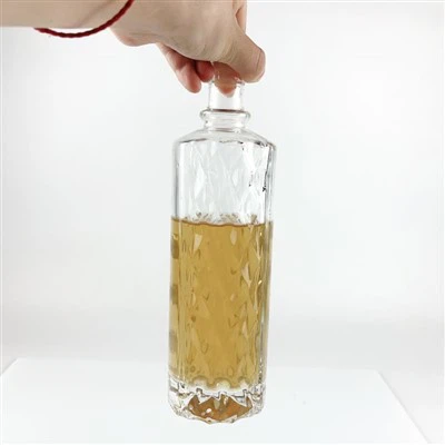 Bouteille en verre cylindrique de 500 ml avec motif en forme de losange en relief