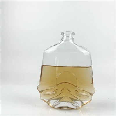 Bouteilles en verre à cognac à col plat sculptées sur la base